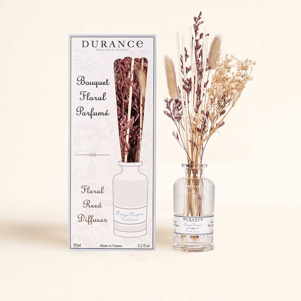 Ambientador mikado con flores secas Ropa Limpia de 95ml junto a su caja original botánica de Durance, ideal para regalo.