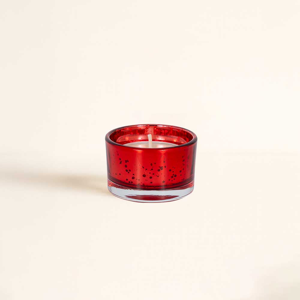 Detalle de una de las 24 velas aromáticas del calendario de adviento Durance en vaso de cristal rojo veteado – D'Arome