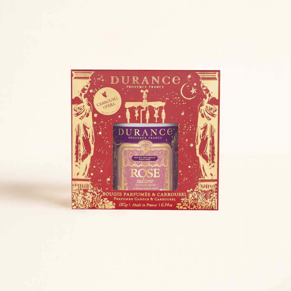 Caja decorativa navideña Vela Carrusel Rose Sultane Durance 180g con ventana troquelada y motivo de teatro dorado – D'Arome