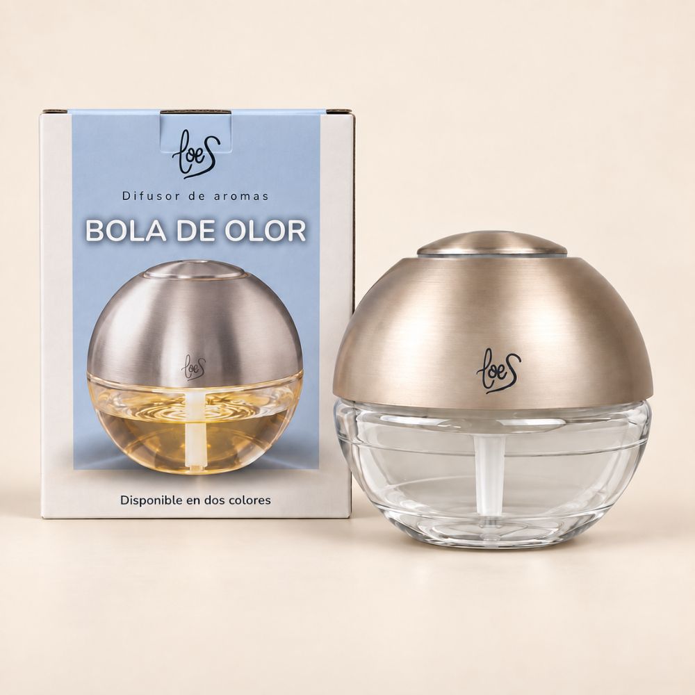 Difusor Bola de Olor pequeña dorada LoeS junto a su caja, elimina malos olores del hogar – D'Arome