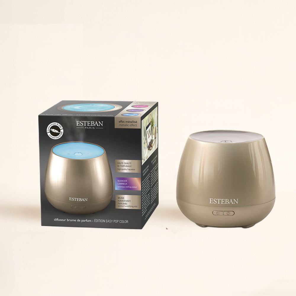 Difusor de aromas Easy Pop Platinium Esteban Paris apagado junto a su caja, acabado metalizado – D'Arome