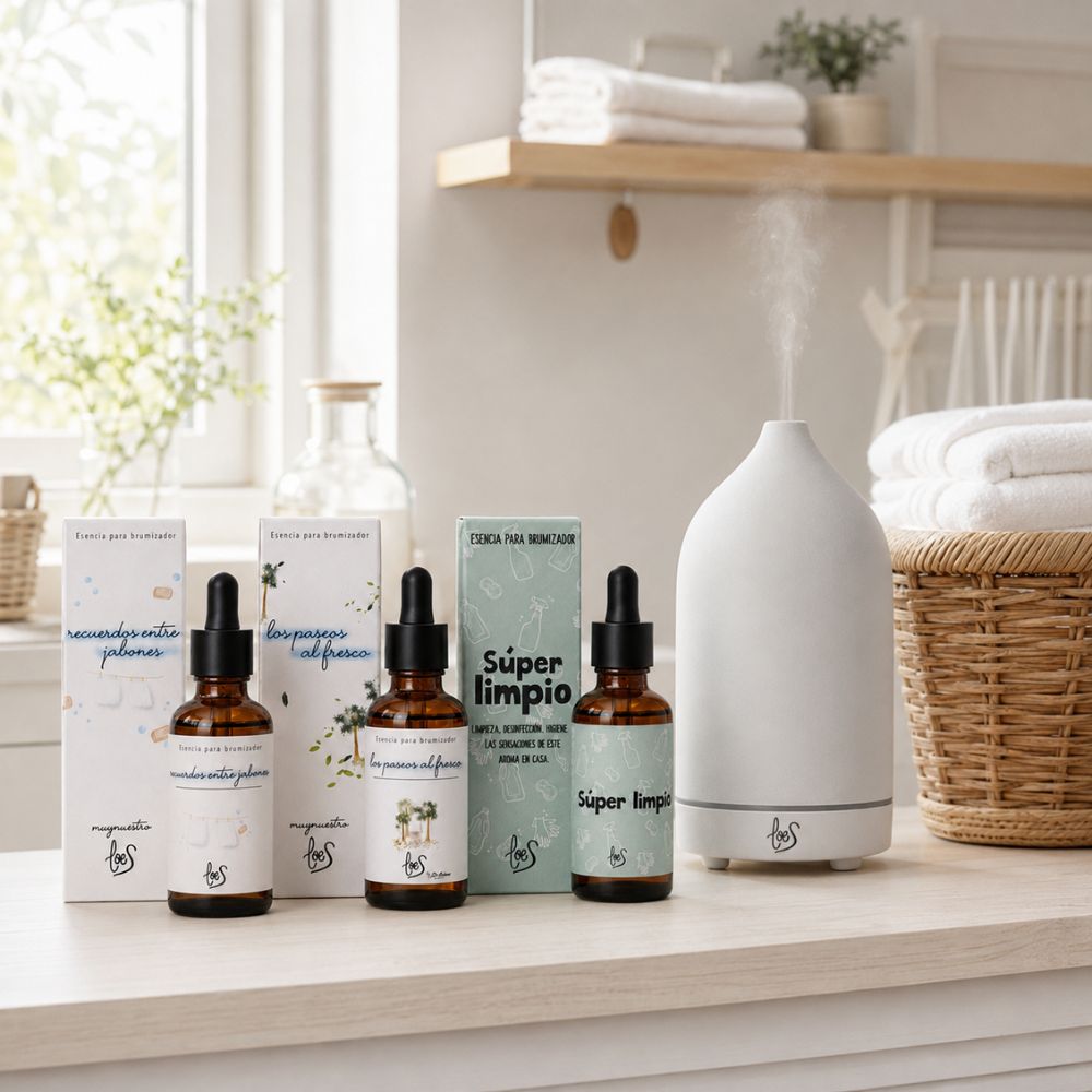 Pack de aromas limpios LoeS Recuerdos entre Jabones, Paseos al Fresco y Súper Limpio junto al brumizador cerámico encendido en lavandería con toallas dobladas – D'Arome