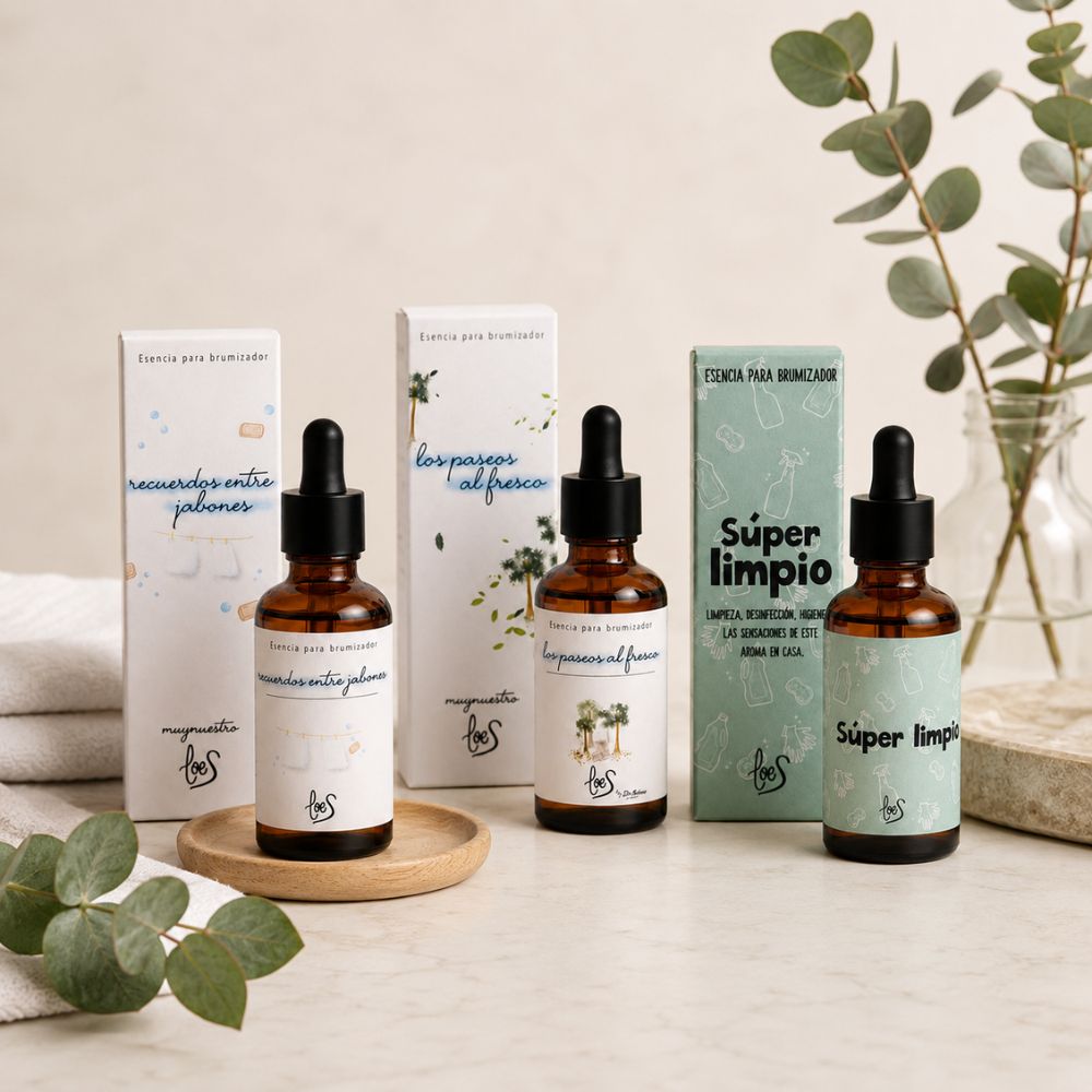 Pack tres aromas limpios LoeS sobre superficie de mármol con eucalipto fresco y toallas blancas en ambiente baño spa – D'Arome