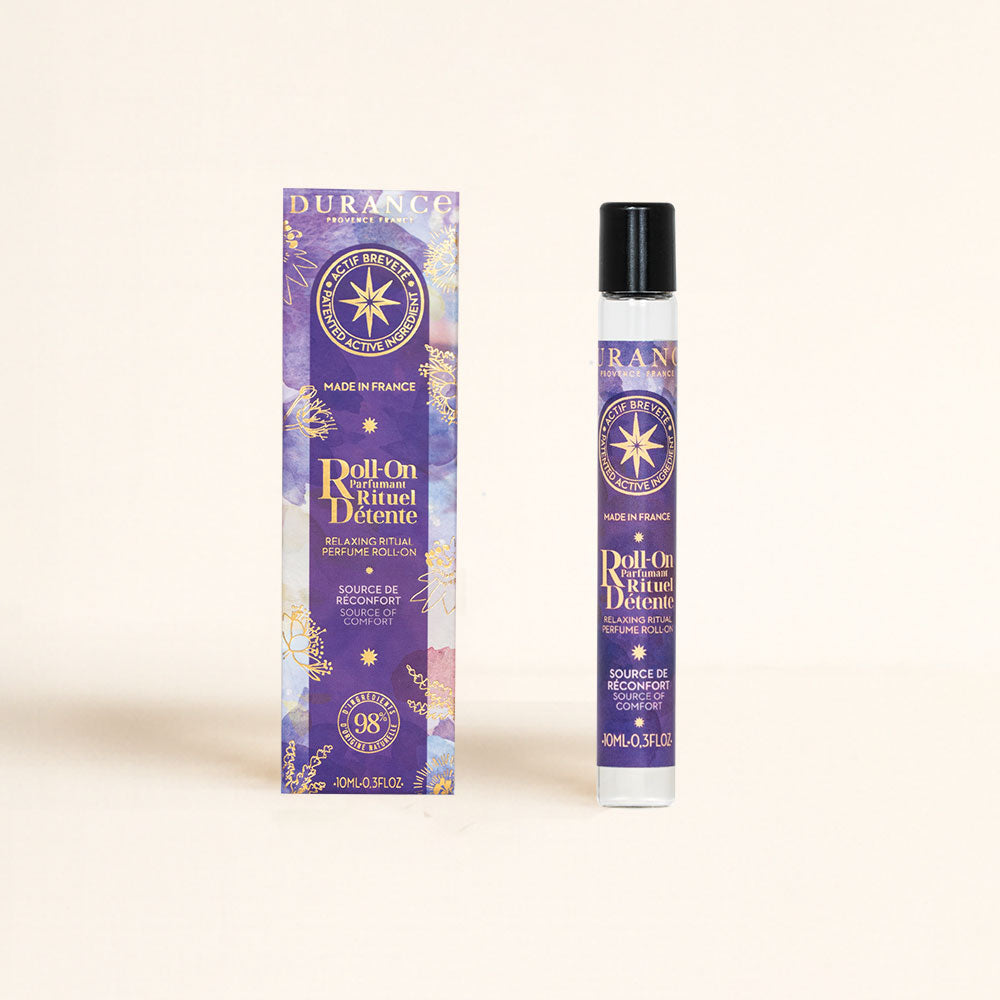 Roll-on perfumado Ritual Détente Colección Serenidad Durance 10ml junto a su caja violeta con motivos de estrellas doradas – D'Arome