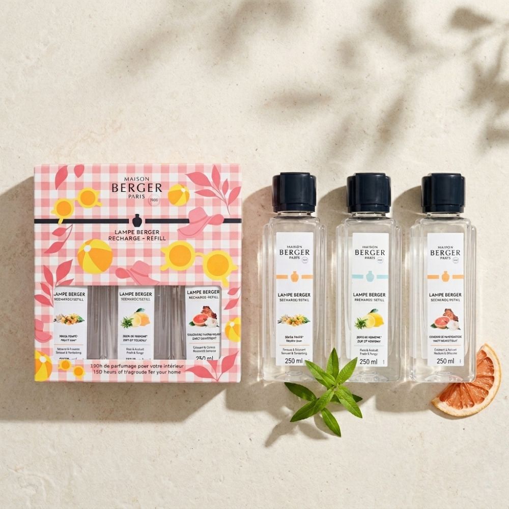 Trio Pack Estivale Maison Berger sobre piedra natural con rodaja de pomelo y hojas verdes ambiente veraniego