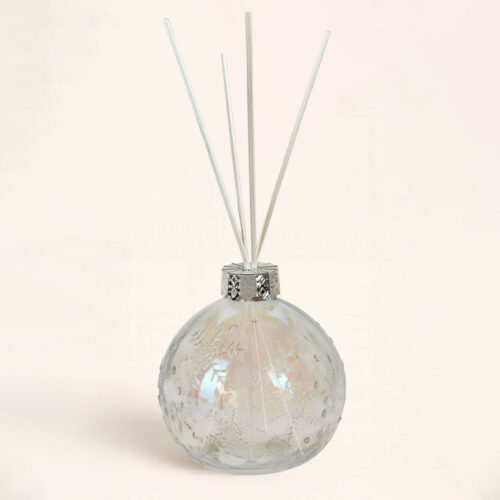 Envase Mikado Navidad Copo de Nieve Transparente. Diseño en cristal y cuello plateado. Elegancia y brillo para perfumar tu hogar.